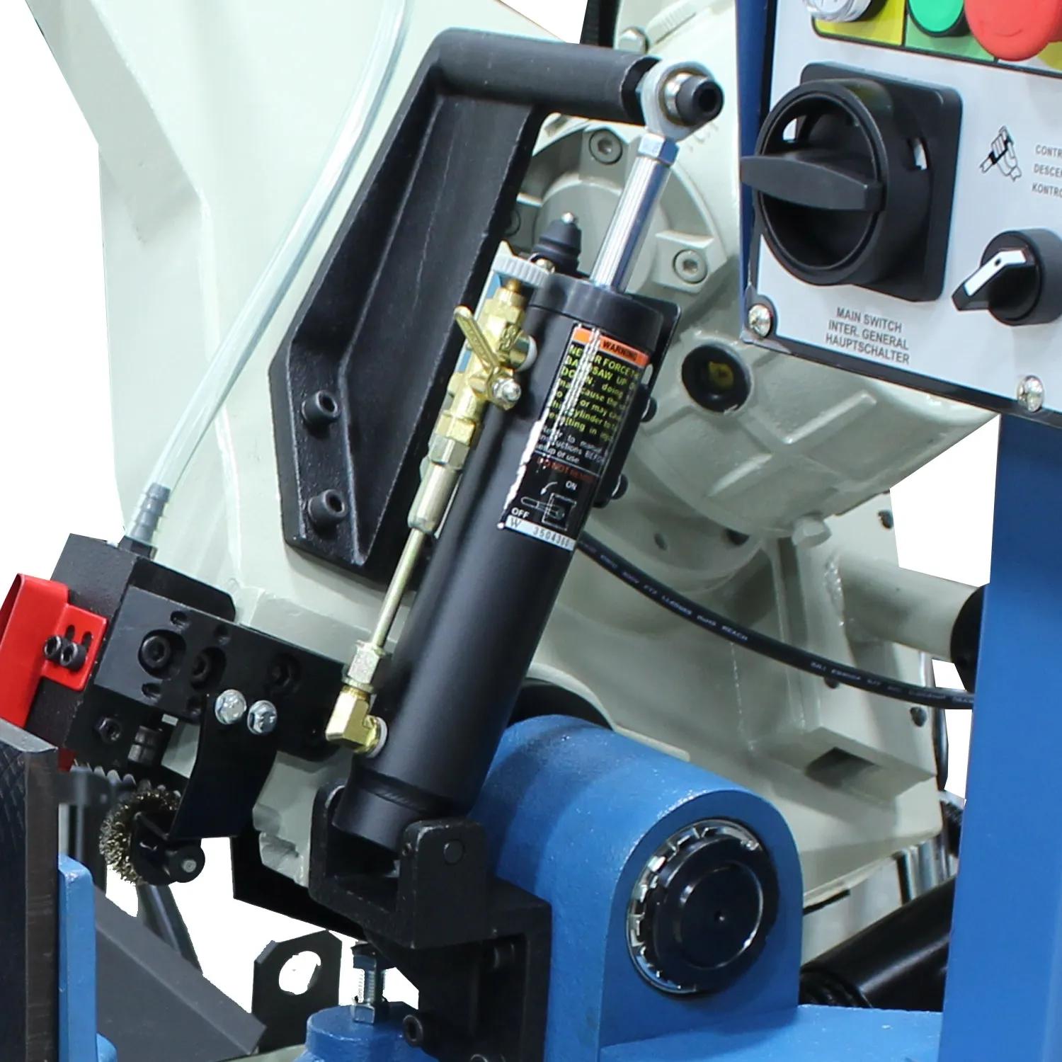 A hydraulic cylinder is used to control the drop rate of the saw blade.