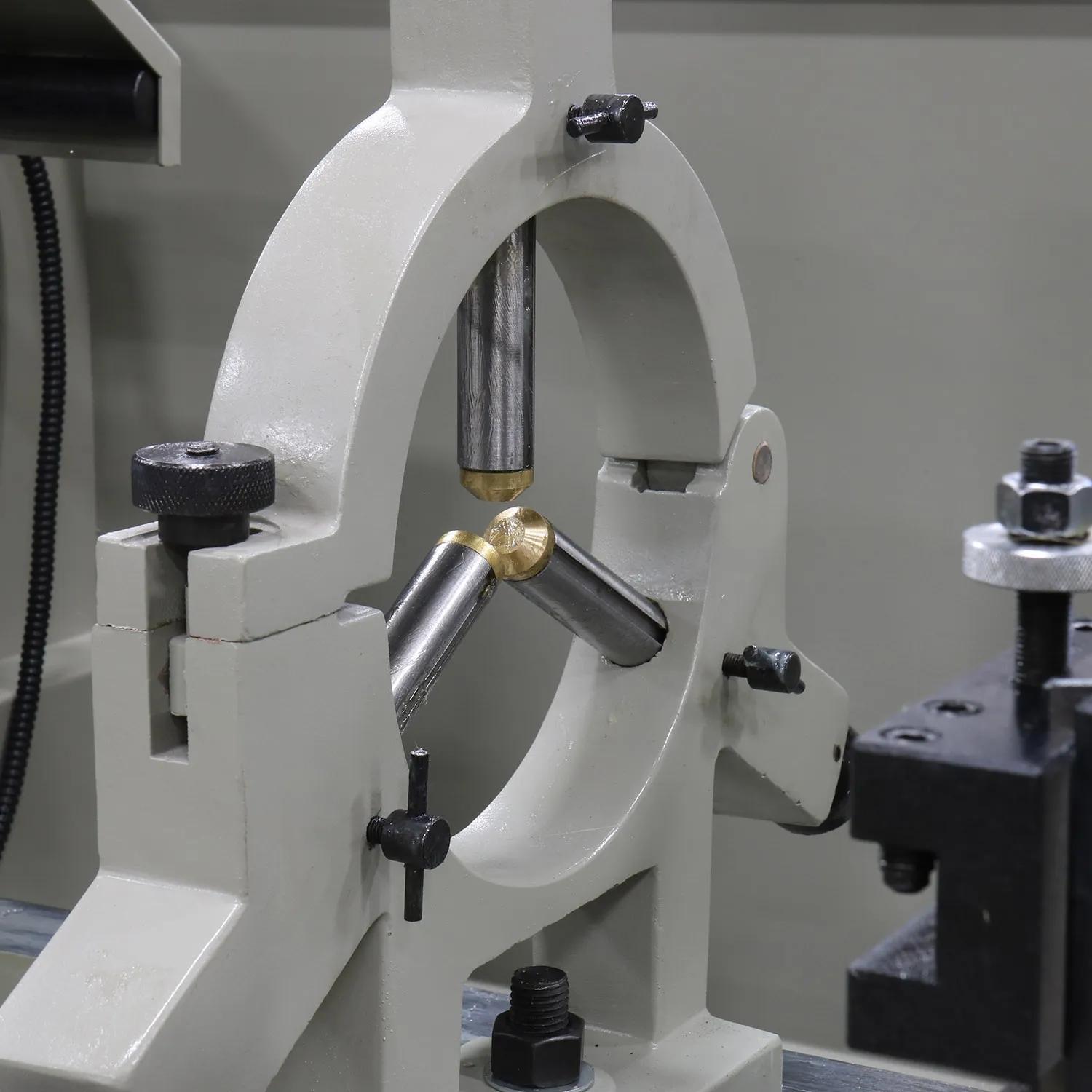 The steady rest on this lathe is used to support long, small-diameter stock that would otherwise be difficult to turn. 